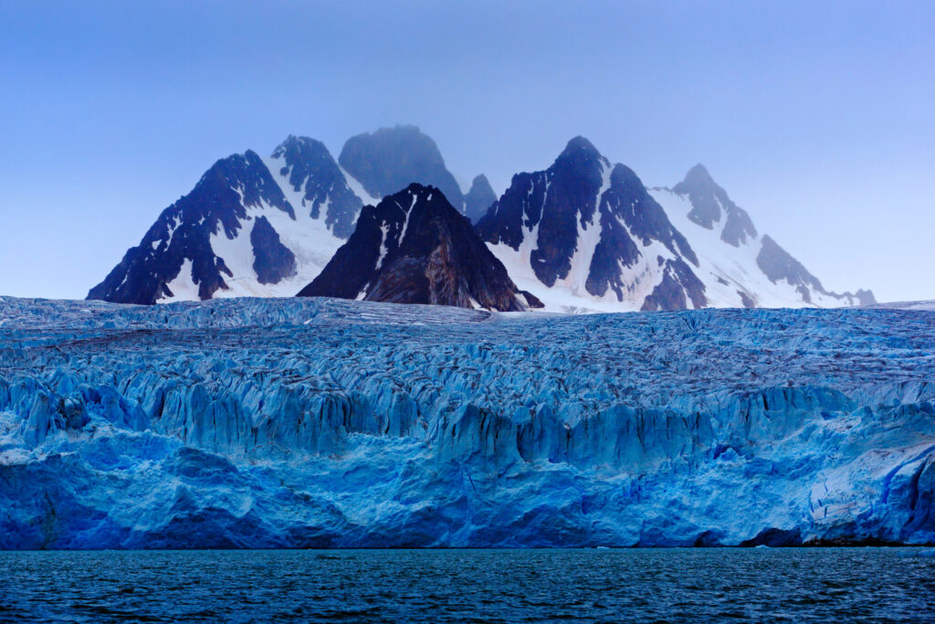 Dark,Winter,Mountain,With,Snow,,Blue,Glacier,Ice,With,Sea