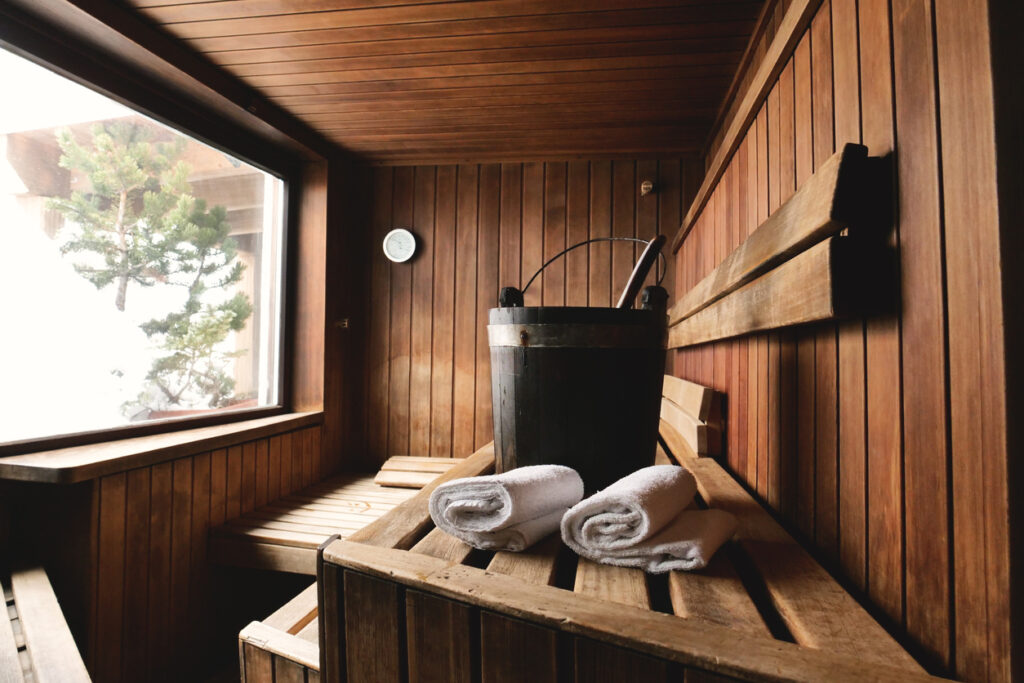 Location of a mountain wood sauna with a large window in which to relax.