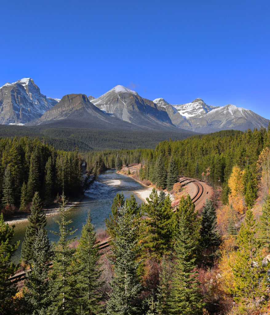 No trains on Morant’s Curve of the Canadian Pacific Railway along the Bow River, backed by the Bow Range snowy mountains. Banff NP-Alberta-Canada-344